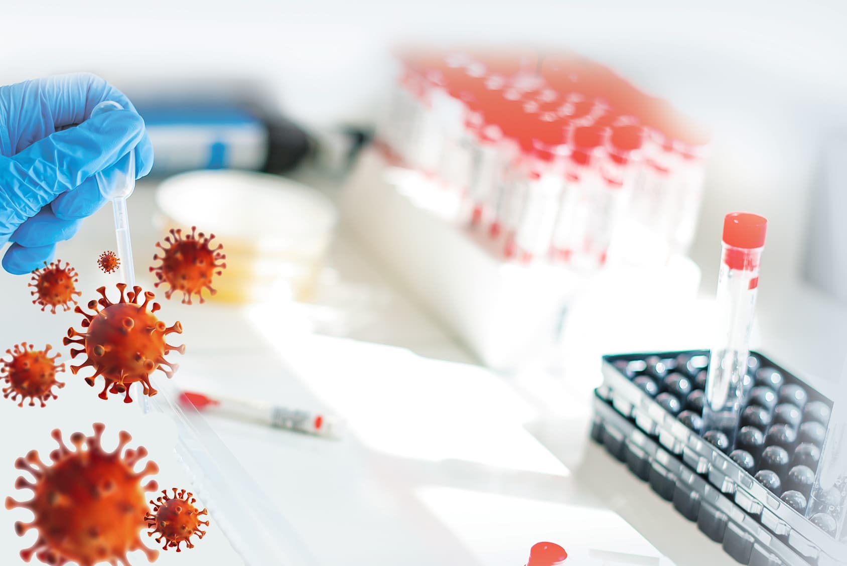 Ręka laboranta trzymająca probówki